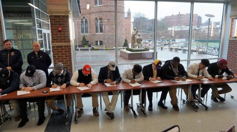 Students from the Class of 18 football players during National Signing Day