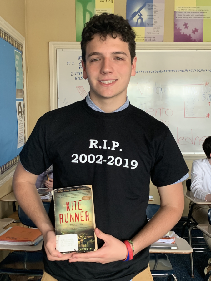 Senior Francesco Gloninger poses with a copy of The Kite Runner, which is of the selections from the senior summer reading list.