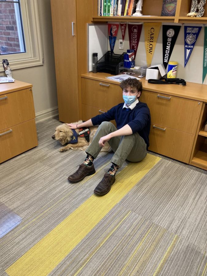 Editor-In-Chief and Senior Joe Stern spends a few moments with Colt in Mrs. Gershons Office.