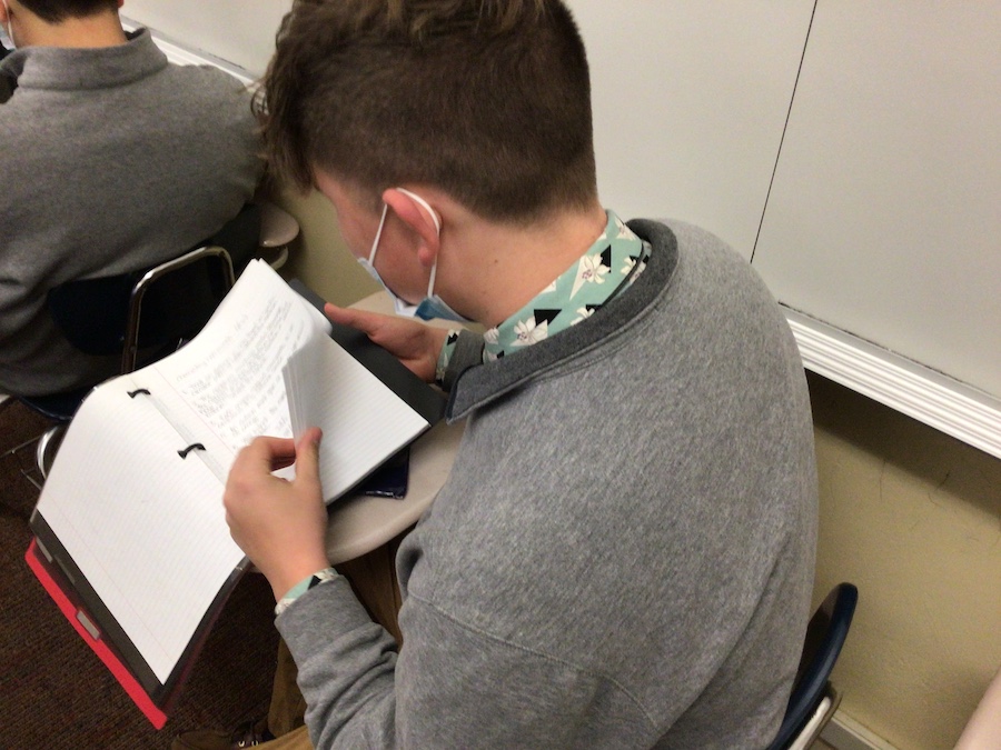Sophomore Jordan Romano reviews his notes to prepare for an upcoming test.