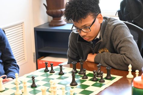 Sophomore Jyhir Hatten focuses on his next move during the most recent Chess Club meeting.