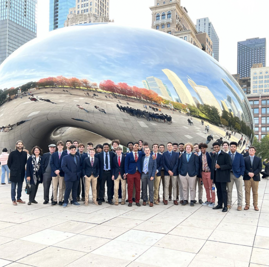 Members of the Baginski Scholars Program gather around The Bean, a popular tourist attraction, in Chicagos Millennium Park.