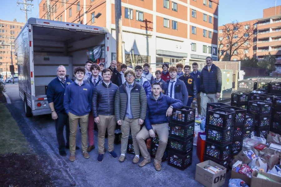 Members of the Lasallians Ministry Team, along with faculty and staff members, are seen loading over 18,000 canned food en route to the Little Sisters of the Poor.